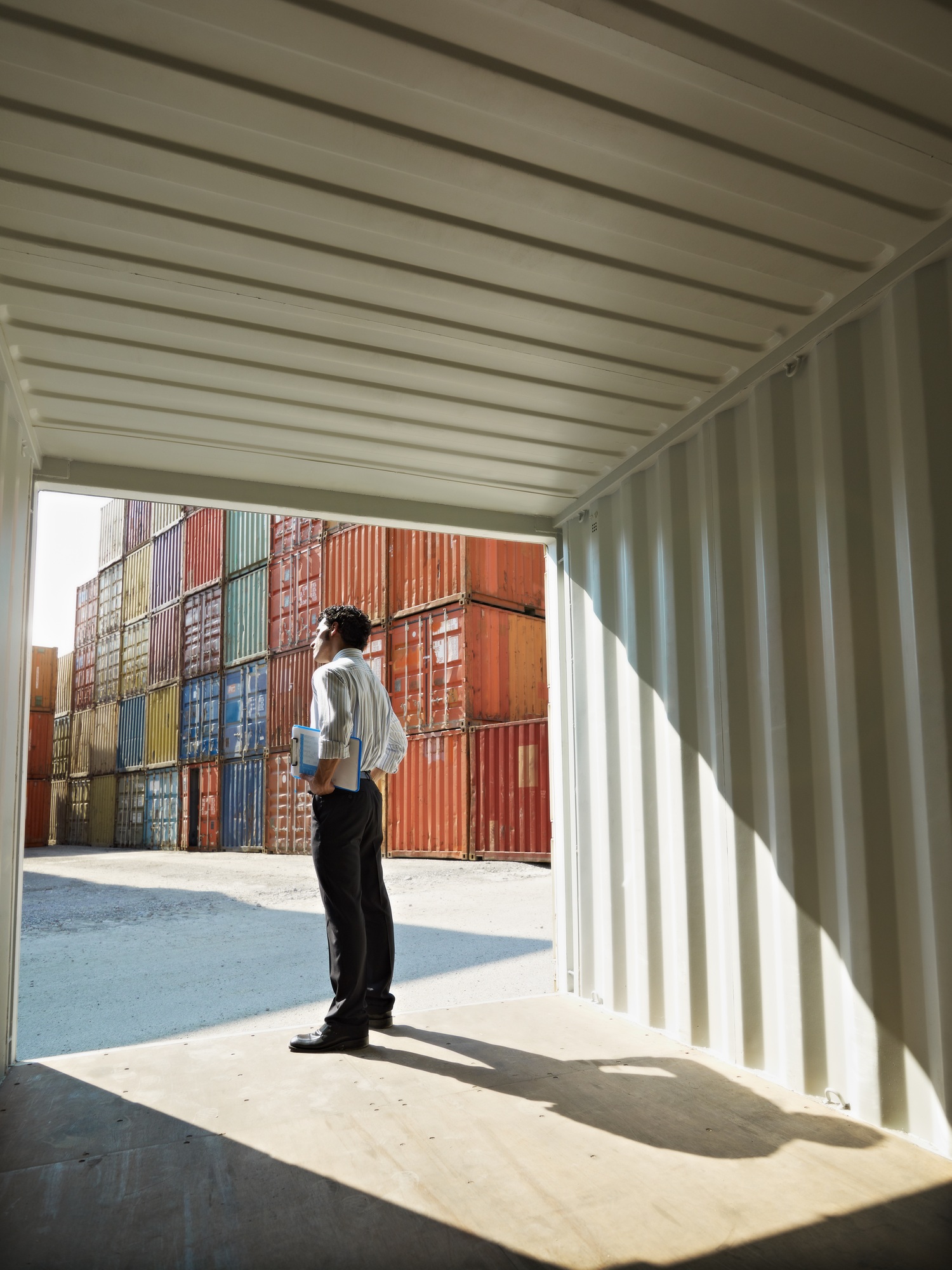 business man with shipping containers
